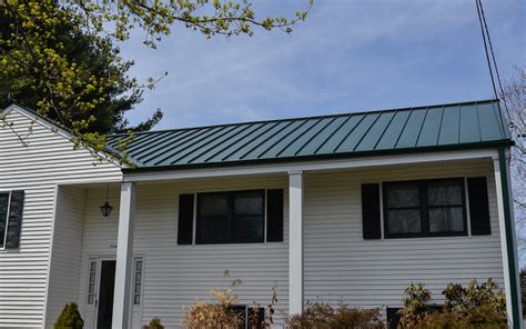 standing seam metal roof on traditional house fairfield ct|connecticut roofcrafters.